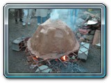 092-base of kiln is proped off the ground until the carcoals